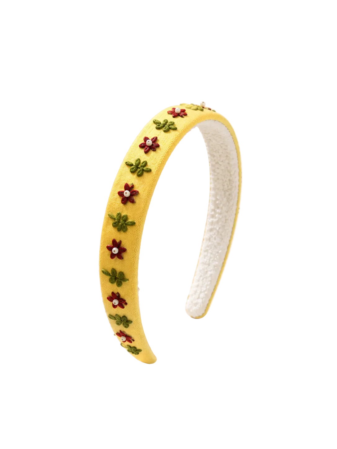 A yellow fabric headband with embroidered red flowers and green leaves, displayed on a warm cream surface with soft fabric and baby's breath props.